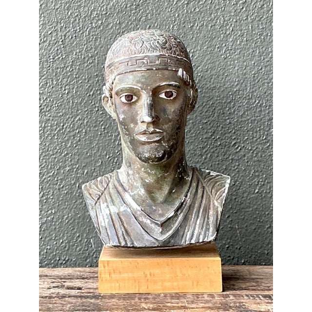Inspired by the enduring beauty of ancient Greek sculpture, this vintage Classical Greek style plaster bust is a refined...