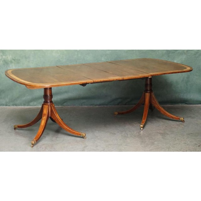 Exceptional Regency Circa 1820 Mahogany Satinwood crossbanded twin pedestal dining table A superb quality English Regency...