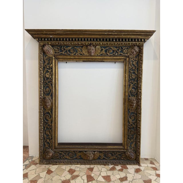 Lombard frame from the early 16th century with a denticulated tympanum in carved, lacquered, and gilded wood with inserts...