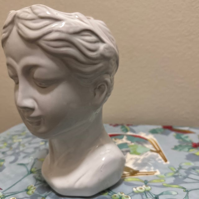 This contemporary ceramic planter updates classical aesthetics for modern interiors. It features a stylized female bust...