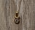 The Alderly Street: Yellow Gold Love Knot Diamond Solitaire Necklace. The necklace features a 0.36 carat round brilliant...