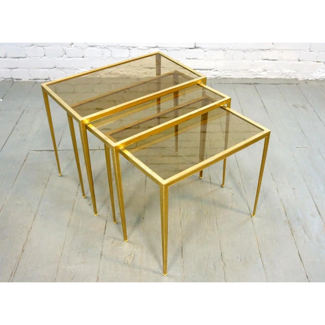 A set of three tables of brass, Vereinigte Werkstätten, Munich, from the 60s Price per set 3pcs Dimensions: 35x50, 55x50,...