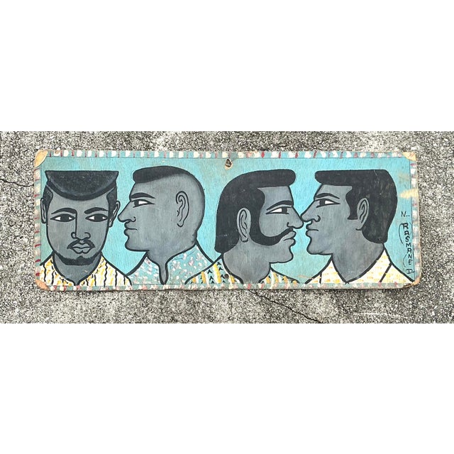 This captivating piece of original 1970s folk art is a hand-painted barber shop sign that perfectly captures a bygone era...
