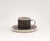 An elegant tea and coffee cup with matching saucer from the iconic "Scenario Metropol" porcelain collection, designed by...
