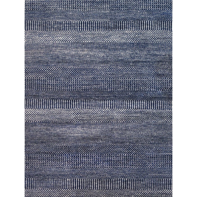 The Handmade, hand-knotted construction adds durability to this rug, ensuring it will be a favorite for many years. Each...