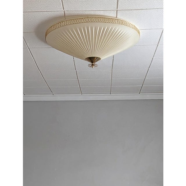 The ceiling lamp was manufactured by Oy Valinte in Finland in the 1950s. Model number 1241. The lamp has a beautiful...