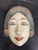 Design Plus Gallery presents an Indonesian Hand-Carved Wood Mask. Sculpted from wood, the mask portrays a serene female...