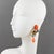 These romantic French designer Zoe Coste clip-on earrings boast a dangling shape with baroque style with a gilt metal...