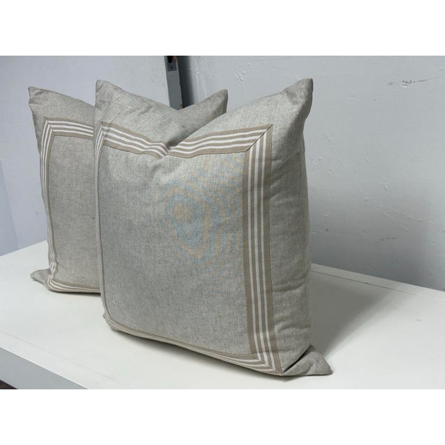 Design Plus Gallery presents a Pair of Striped Border Decorative Pillows from Thom Filicia Home Collection. These square...