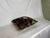 One gorgeous accent pillow. The bright colors appear so rich and vibrant atop the warm brown background. This would bring...