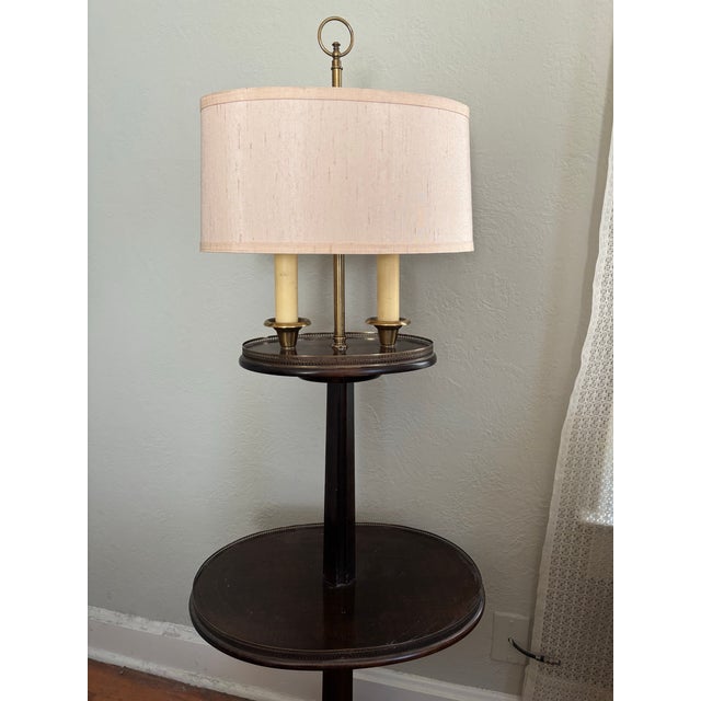 2 tier with brass gallery railing accents, push button switch, linen shade with finial, pedestal base with large brass...