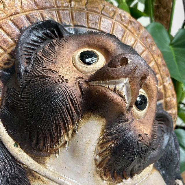 Cheerful Tanuki statue, crafted in the 1960s from classic Shigaraki ware. This traditional pottery from the Shiga region...