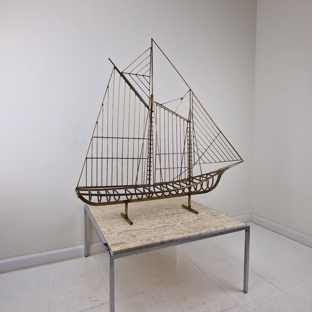 This exceptional 1976 mid-century modern brass wire sculpture by the renowned design duo curtis jeré is a standout...