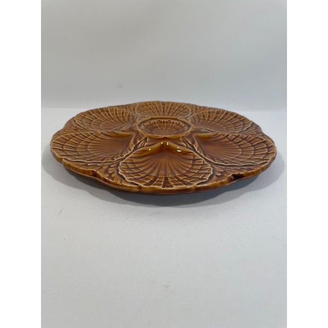 A stunning deep gold/amber French Majolica Sarreguemines Oyster Plate, circa 1920s-30s. Signed Sarreguemines on the back...
