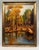 This original, vintage oil landscape painting on canvas board depicts a serene autumn scene featuring a cluster of tall,...