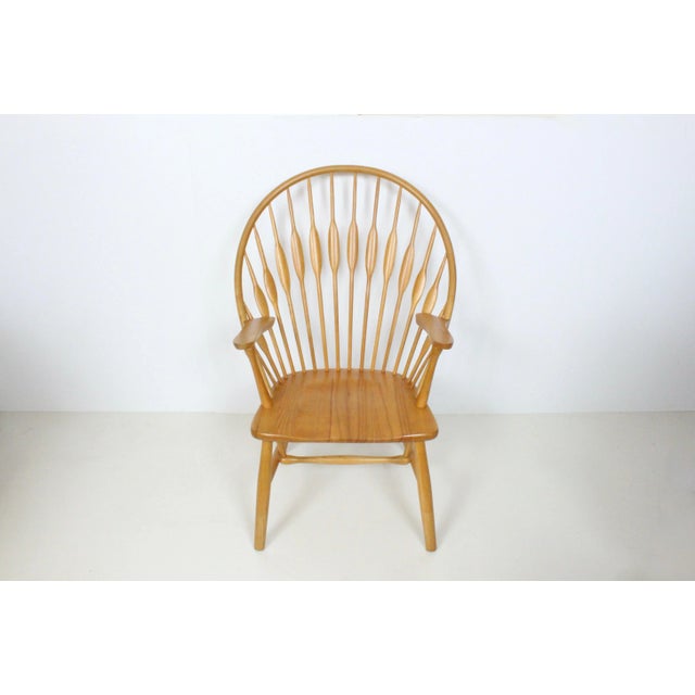 Iconic Solid Ash Wishbone Lounge Armchair in the style of Hans Wegner, 1970's. Featuring professionally refinished solid...