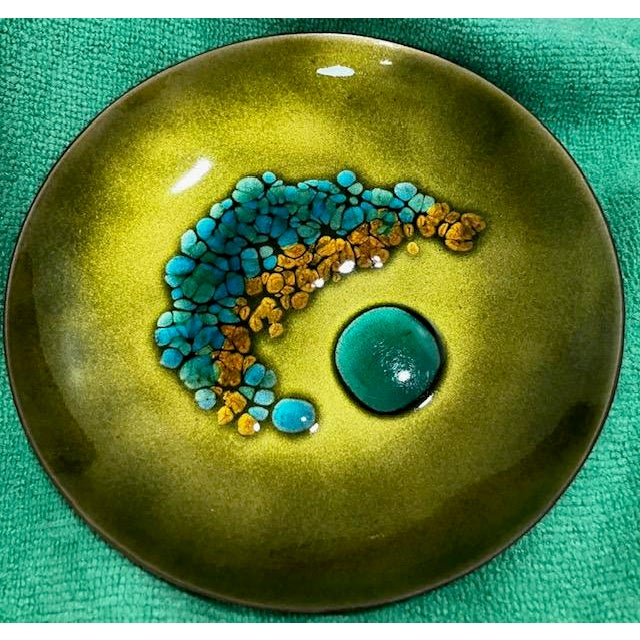 Gorgeous enamel dish with an abstract "raised pebble" texture with turquoise, blue & gold molted pebbles fused onto a...