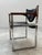 Fantastic, very exclusive, and rare set of two conference chairs with a solid, chrome-plated steel frame and black leather...
