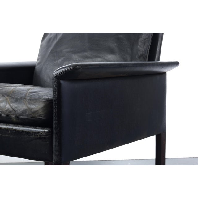 Perfectly worn in black leather and rosewood model #500 lounge chair by Hans Olsen for CS Møbler Glostrup. Made in...