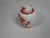 This vintage porcelain Chinese ginger jar is hand decorated in red Lotis designs on a white background. It would be a...