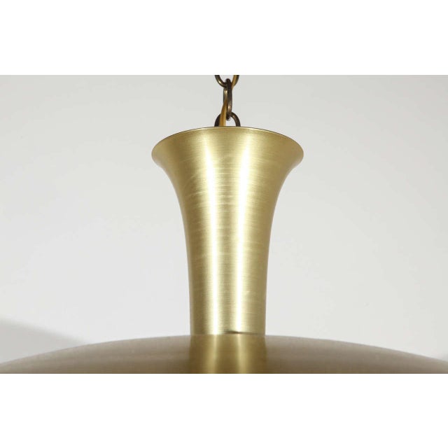 Spun aluminum pendant with anodized brass finish. Newly rewired for a single standard bulb. Eight available.