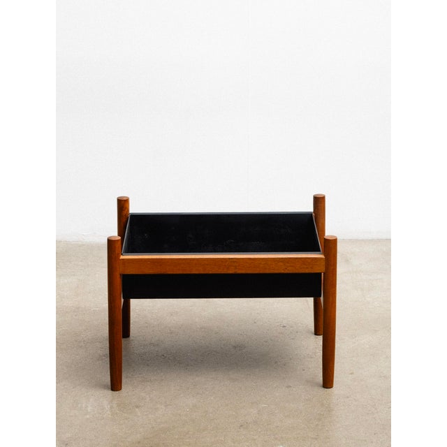A vintage Danish teak planter by Hugo Frandsen for Spøttrup Stolefabrik, featuring a removable black metal insert. Hugo...