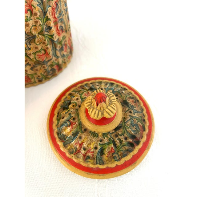Beautiful set of three Italian ceramic lidded canisters in an all-over ornate floral design with figural flower handle on...
