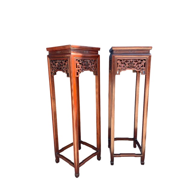 Pair of elegant and tall antique Chinese Rosewood pedestal stands. Each stand is incredibly ornate with gorgeous carvings....