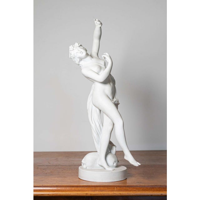 This exquisite 19th-century French sculpture, crafted from white marble or a similar material, beautifully captures a...
