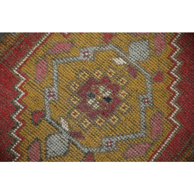 Introducing our exquisite vintage mini Turkish rug, expertly crafted by skilled artisans using traditional techniques that...