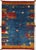 Vintage Persian hand-knotted Lori Gabbeh wool rug featuring a deep blue field accented with vibrant tribal motifs and...