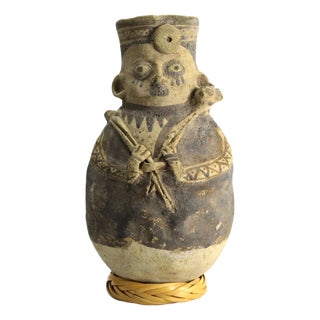 Peruvian Bichrome Figural Effigy Jar of a Hunter With Trophy For Sale