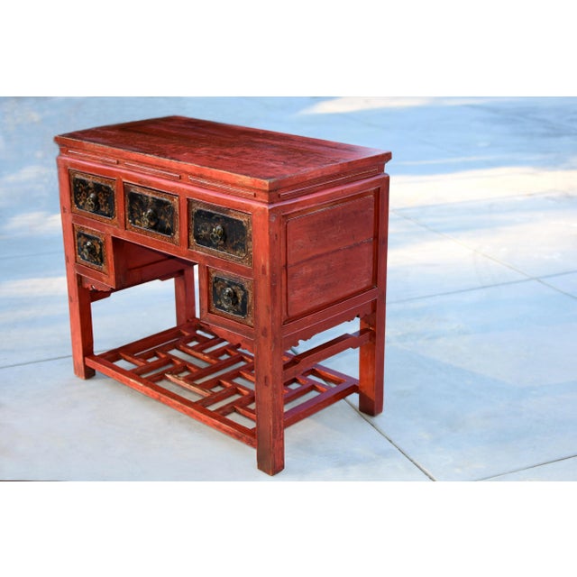 The 19th-century red lacquered solid wood Chinese table from Fujian province is a remarkable piece of late Qing dynasty...