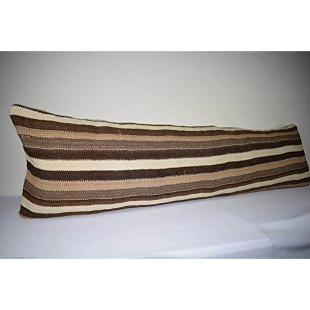 This handwoven kilim pillow is made from Anatolia and Middleast Kilim fragments. Each of our kilim pillow cover is cut...