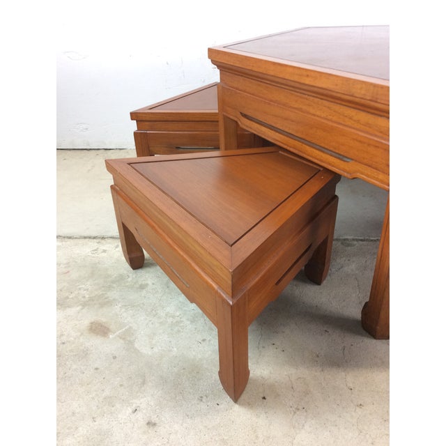 This Danish modern style tea table features hardwood construction, original teak finish, four unique shaped seats that...