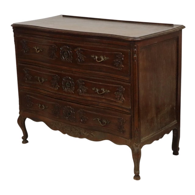 Antique bombé chest of drawers made of solid oak and bronze handles, circa 1880, France. Beautiful and high-quality chest...