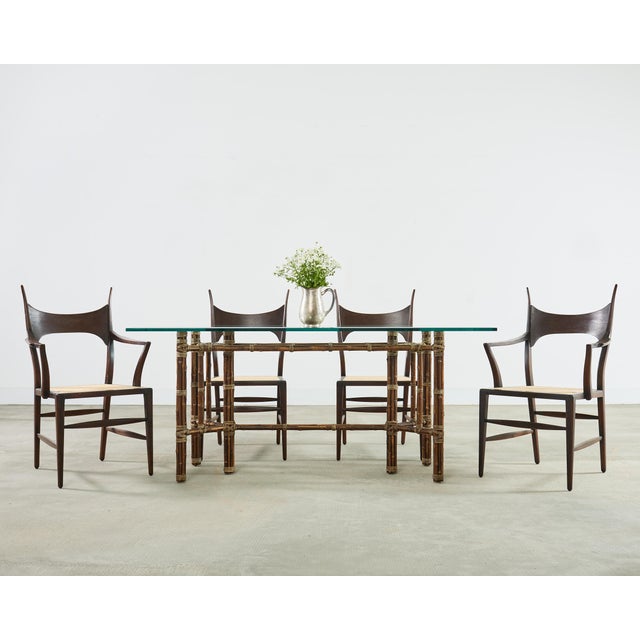 An iconic and rare set of four horned antler chairs designed by Edward Wormley for Dunbar. Known as 5580 model these...