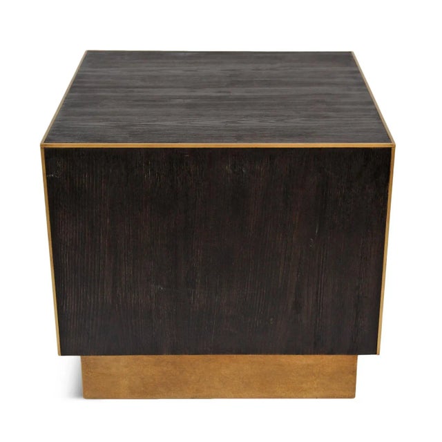 Modern dark stained wood square cube side table with brass finish inlay trim. Simple and clean design. Each table may vary...