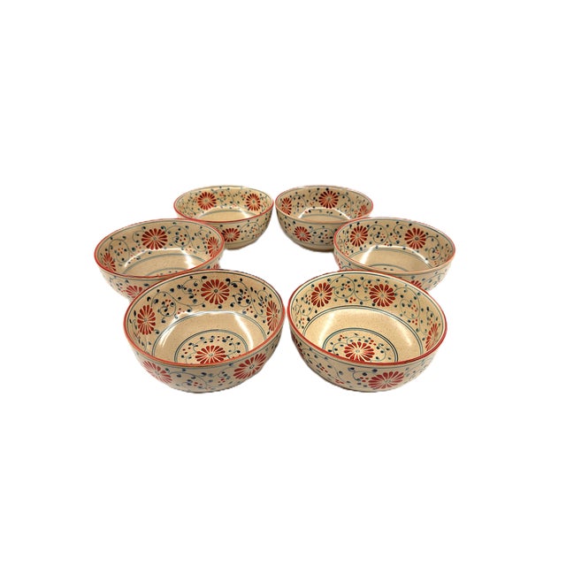 A beautiful set of six Bat Trang ceramic soup bowls, made in Vietnam and decorated with a warm, richly detailed floral...