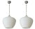 A sleek and timeless set of six Italian Murano glass pendant lights, each featuring a large hand-blown, onion-shaped shade...
