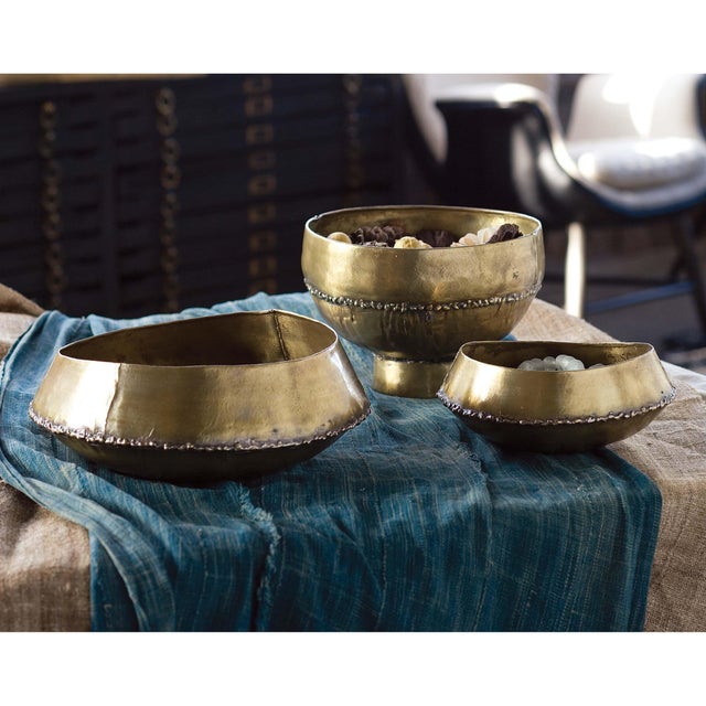 This bowl features a round silhouette with a soldered seam that rings the design. Carefully crafted in brass, this bowl...