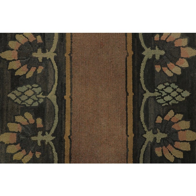This antique 3x4 hooked rug, circa 1920–1929, features a restrained floral border design in warm terracotta, olive, and...