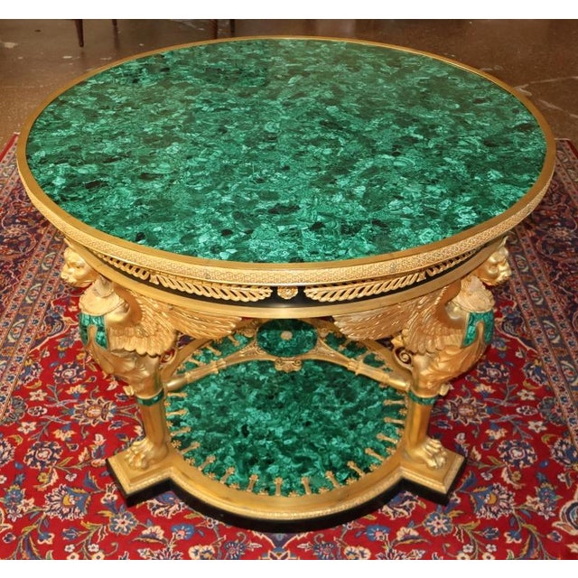 Russian Empire Style Gilt Bronze & Malachite Griffin Center Table Dimensions : 43" Round X 34.25" Tall This magnificent...