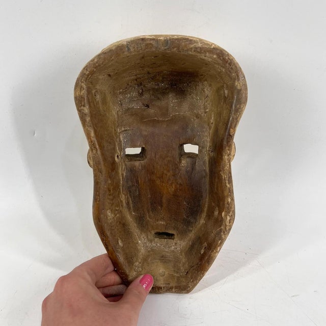 This mask comes from the Nyanga (Banianga/Banyanga/Kinyanga) people of the Kivu region in the Democratic Republic of...