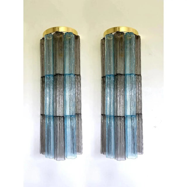 Contemporary and impressive multicolor “tronchi” wall sconces. a pair of luxury and scenographic wall sconces made in...