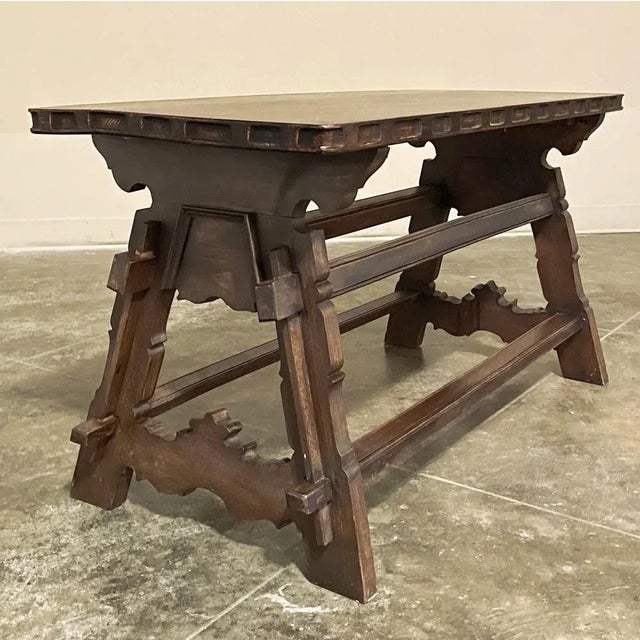 Antique Rustic Spanish Coffee Table is a great choice for a cozy, casual decor. Hand-crafted from solid oak, it features a...