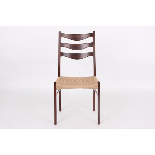 4 used dining table chairs made of rosewood wood. Danish design. The chairs are in good and stable condition. The chairs...