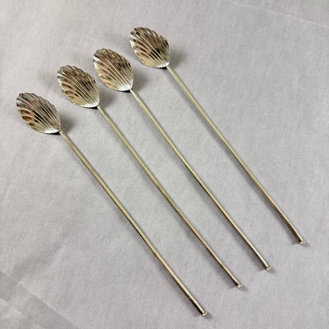A set of four hand made Sterling Silver highball or iced tea hollow sipping and stirring straws with ridged shell shaped...