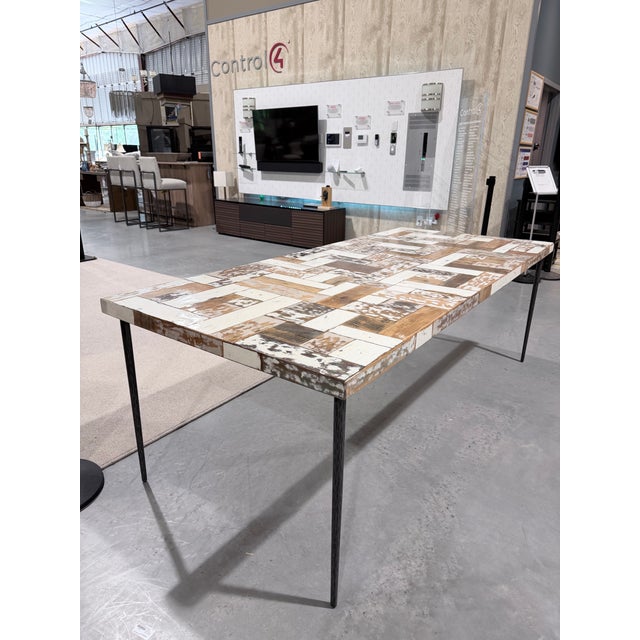 A bold and artistic dining table from Interlude Home that captures the spirit of Mid-Century Modern design through...