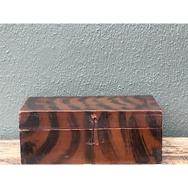 This striking vintage primitive box is a remarkable example of expressive folk art and rustic charm. Meticulously hand-...